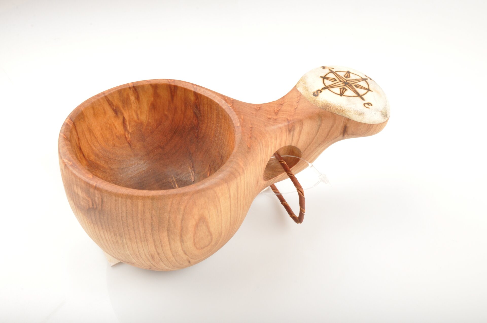 Wooden cup with bone and picture Compass